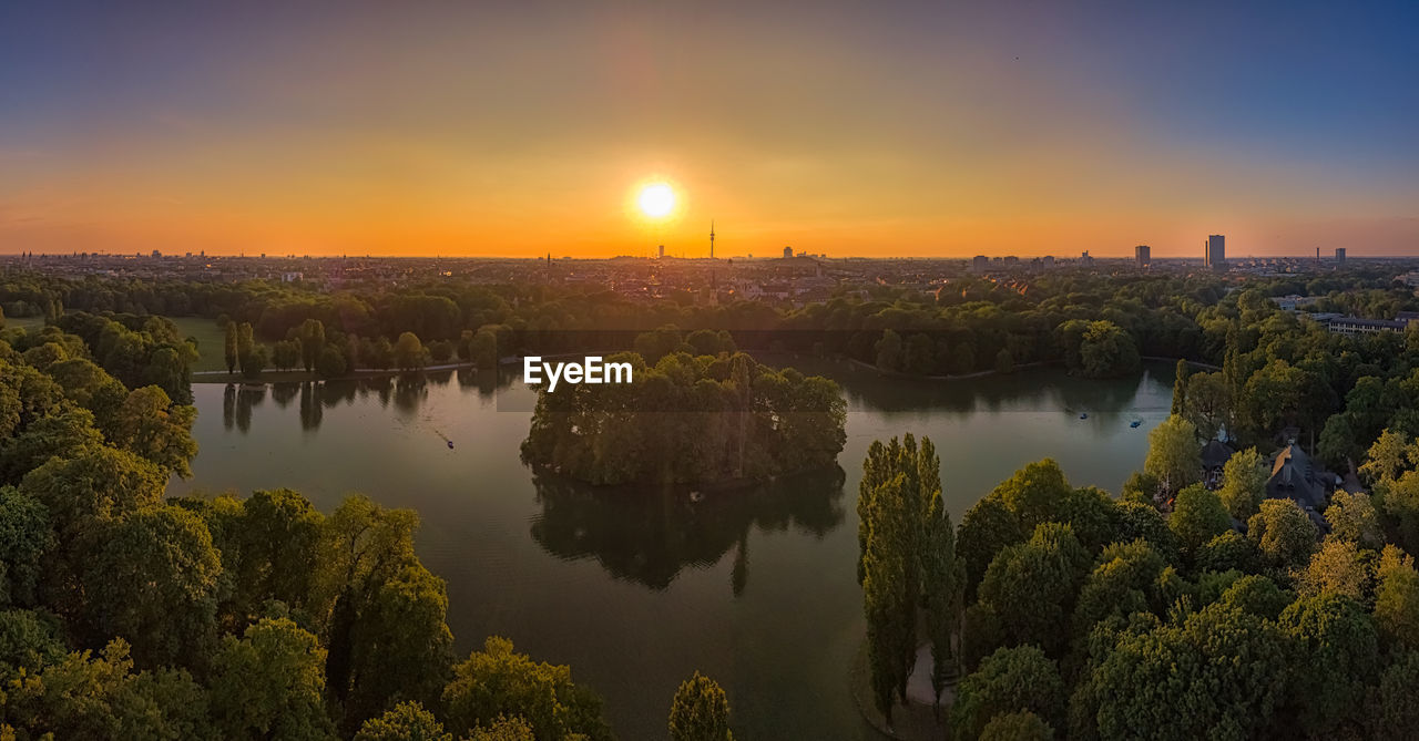 Scenic view of lake against sky during sunset