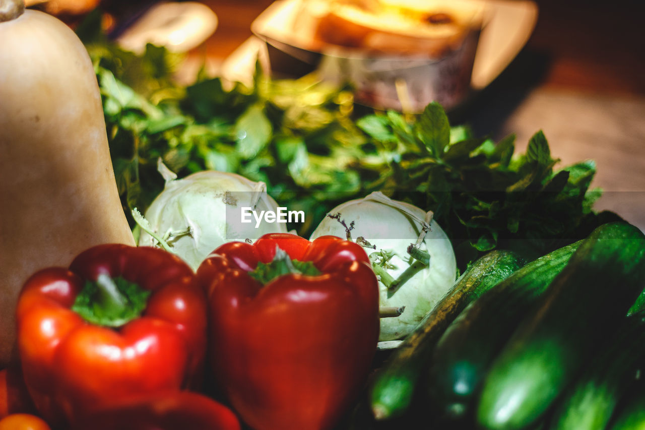 CLOSE-UP OF RED BELL PEPPERS AND TABLE