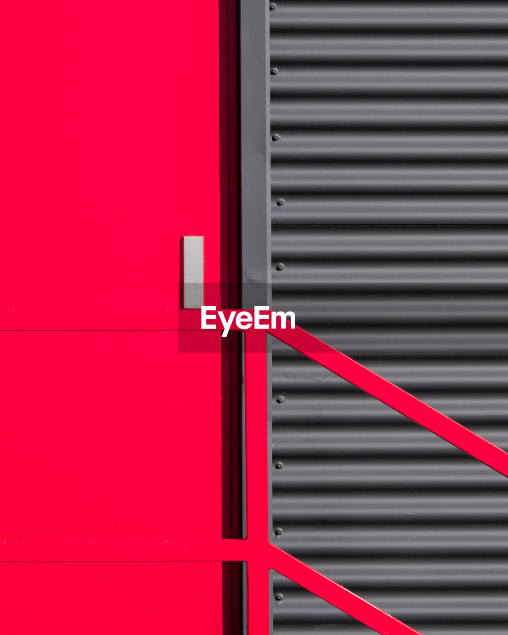 Full frame shot of red metal door and wall