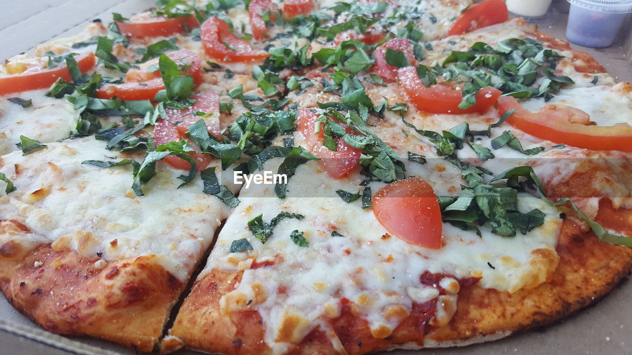 CLOSE-UP OF PIZZA AND SALAD