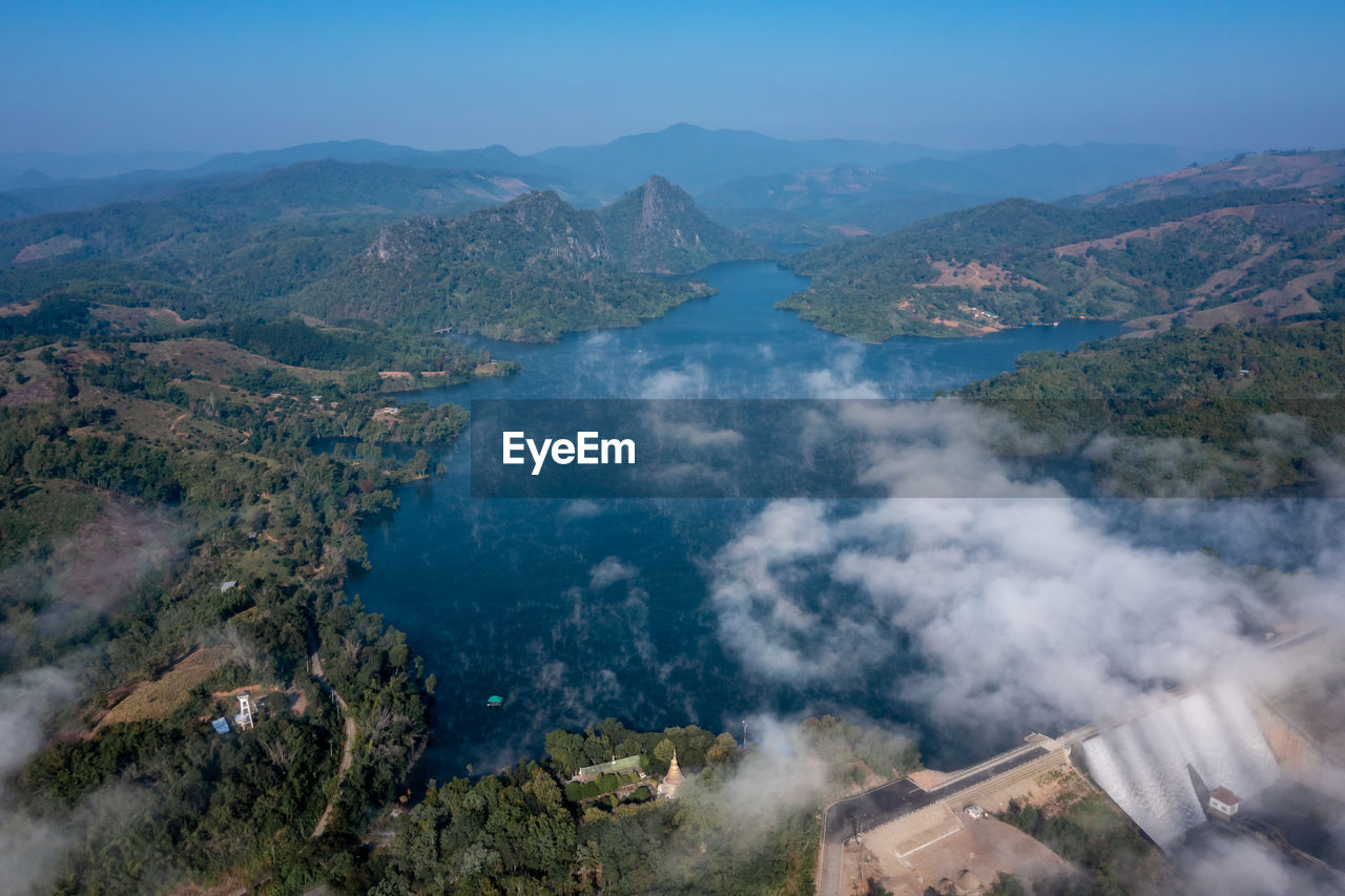 Beautiful landscape aerial view mae suai dam or reservoir in valley mountain and blue sky background 