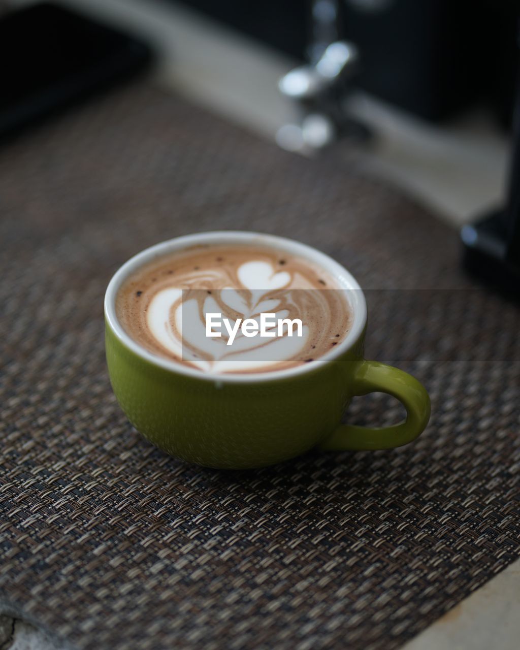 Close-up of cappuccino on table