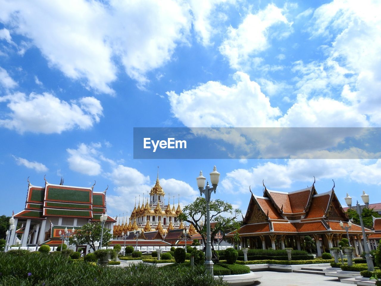 TEMPLE AGAINST CLOUDY SKY