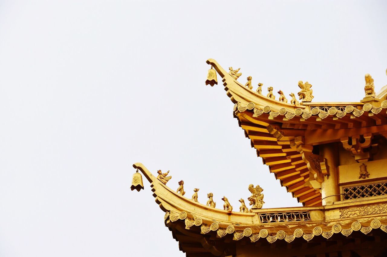 LOW ANGLE VIEW OF TEMPLE AGAINST CLEAR BLUE SKY