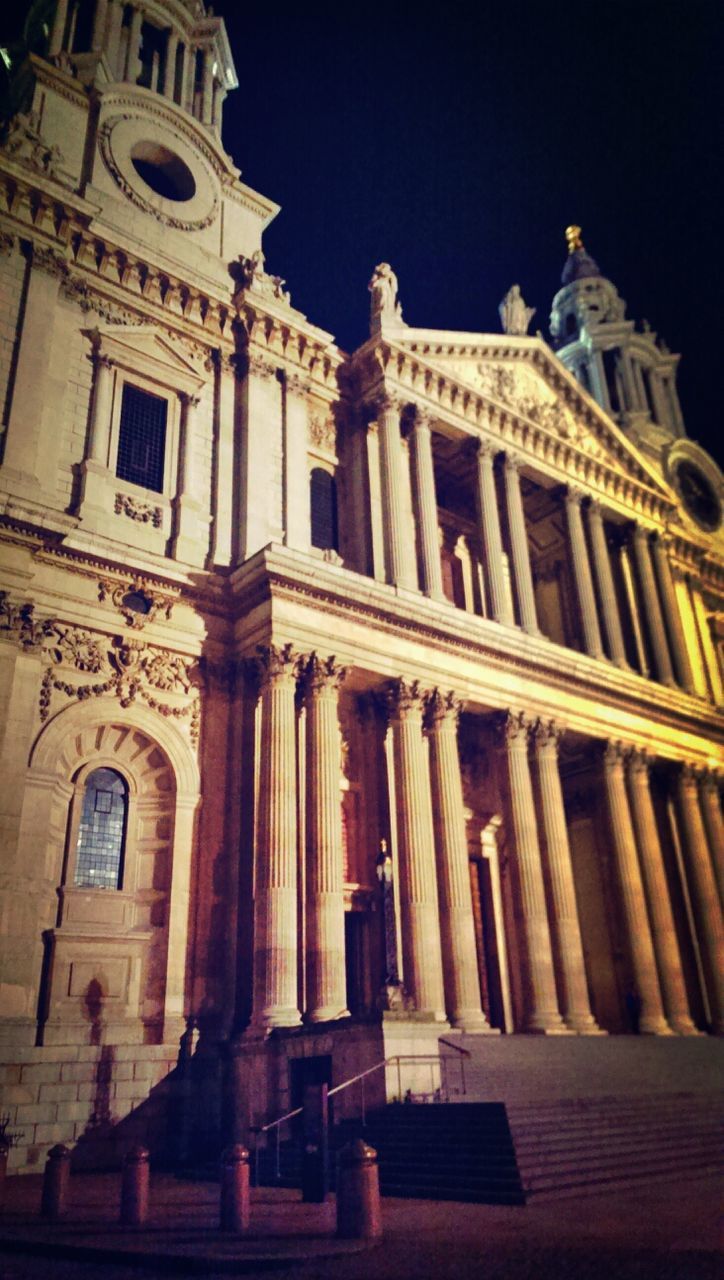 LOW ANGLE VIEW OF TEMPLE AT NIGHT