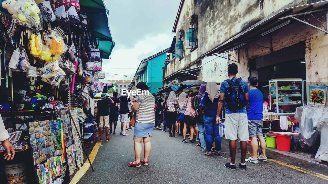 PEOPLE ON STREET IN CITY