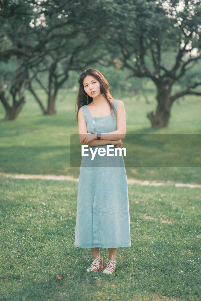 Young woman standing on field