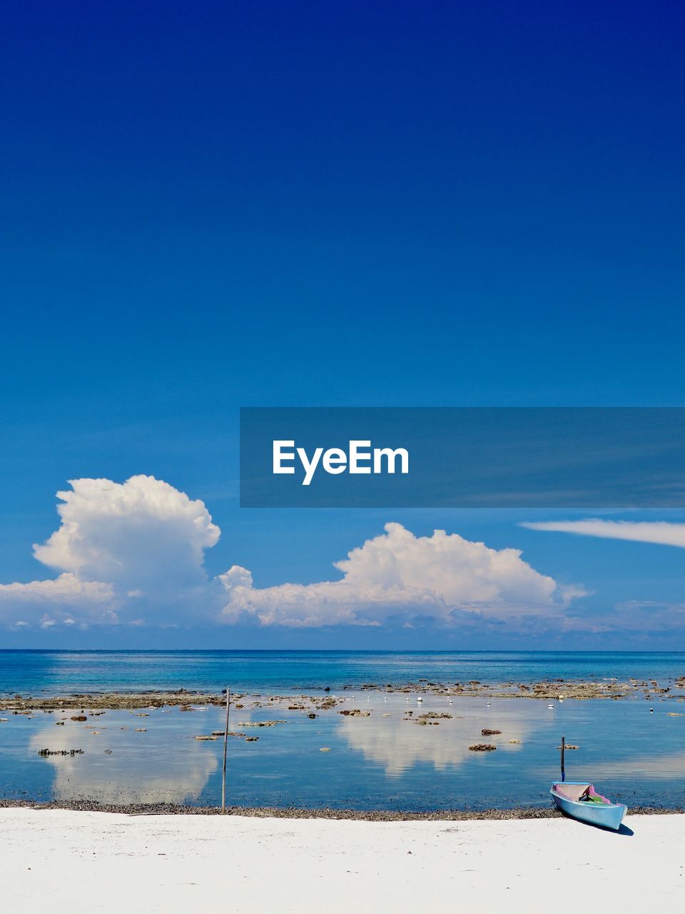 Scenic view of sea against blue sky