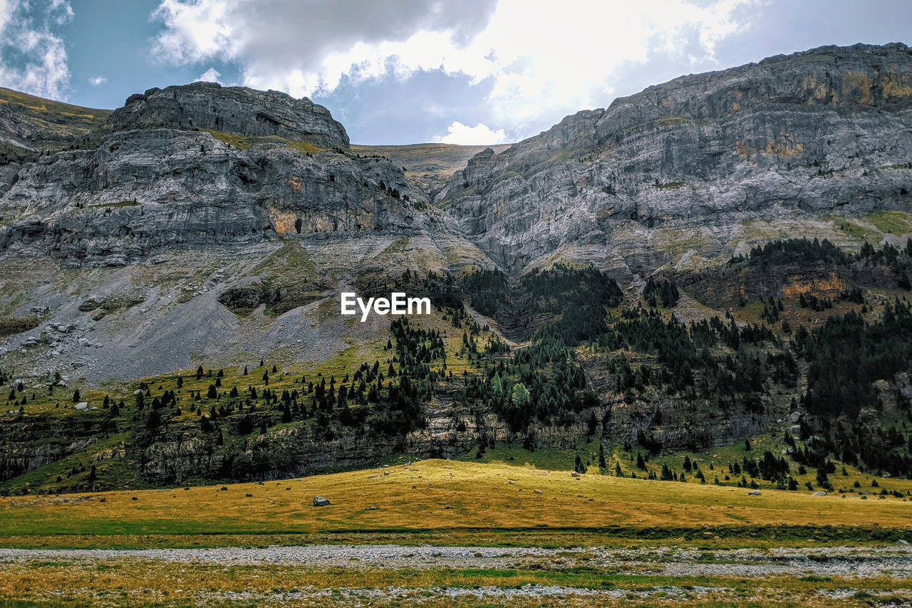 Scenic view of rocky mountains against sky