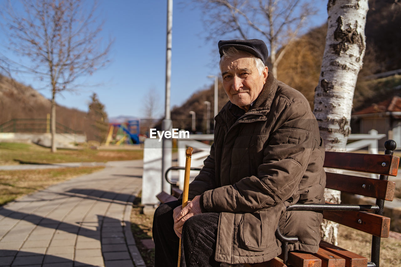 Senior man sitting on bench