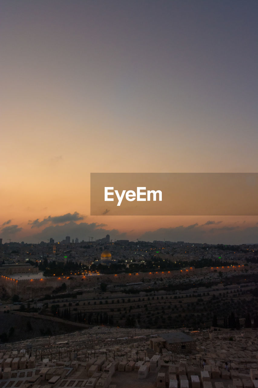 HIGH ANGLE VIEW OF BUILDINGS DURING SUNSET