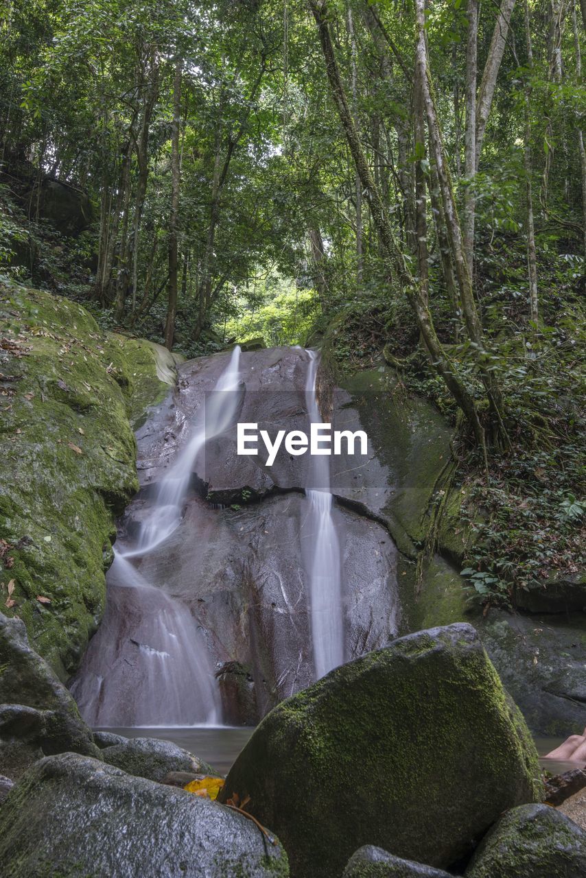 STREAM FLOWING THROUGH ROCKS