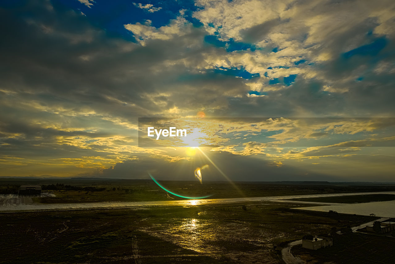 SCENIC VIEW OF SUNSET OVER SEA