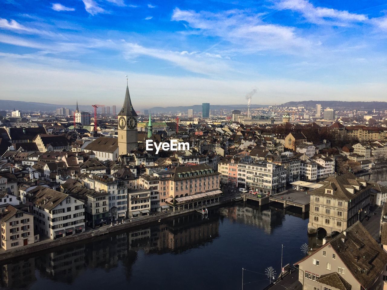 HIGH ANGLE VIEW OF CITY AGAINST SKY