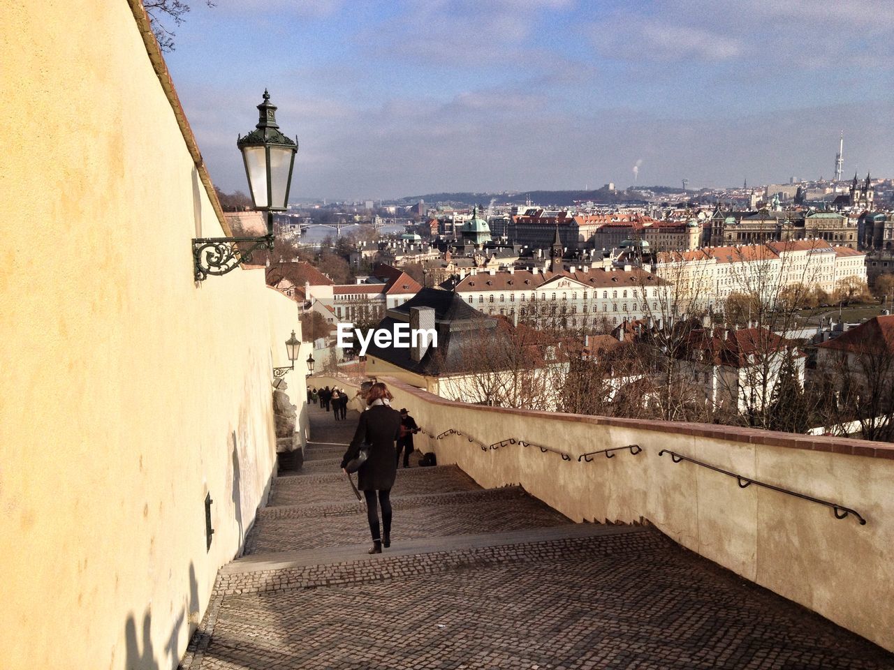 Overhead view of woman moving down steps