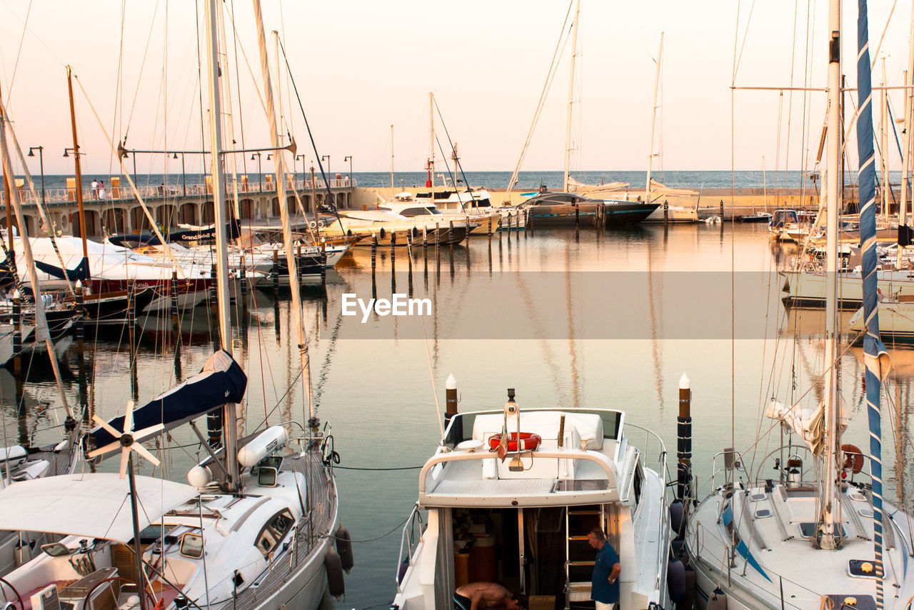 Boats moored at harbor