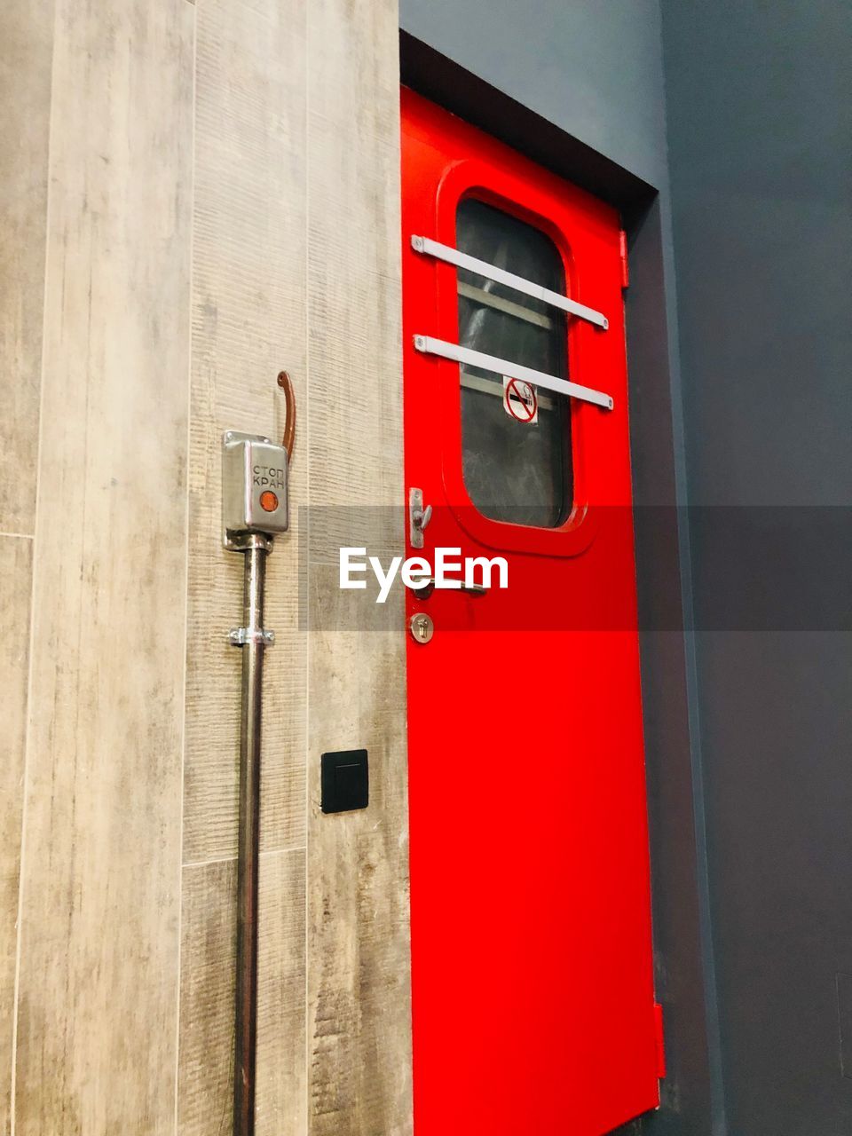 Close-up of red closed door of building