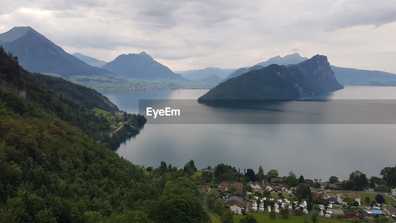 Scenic view of lake and mountains against sky