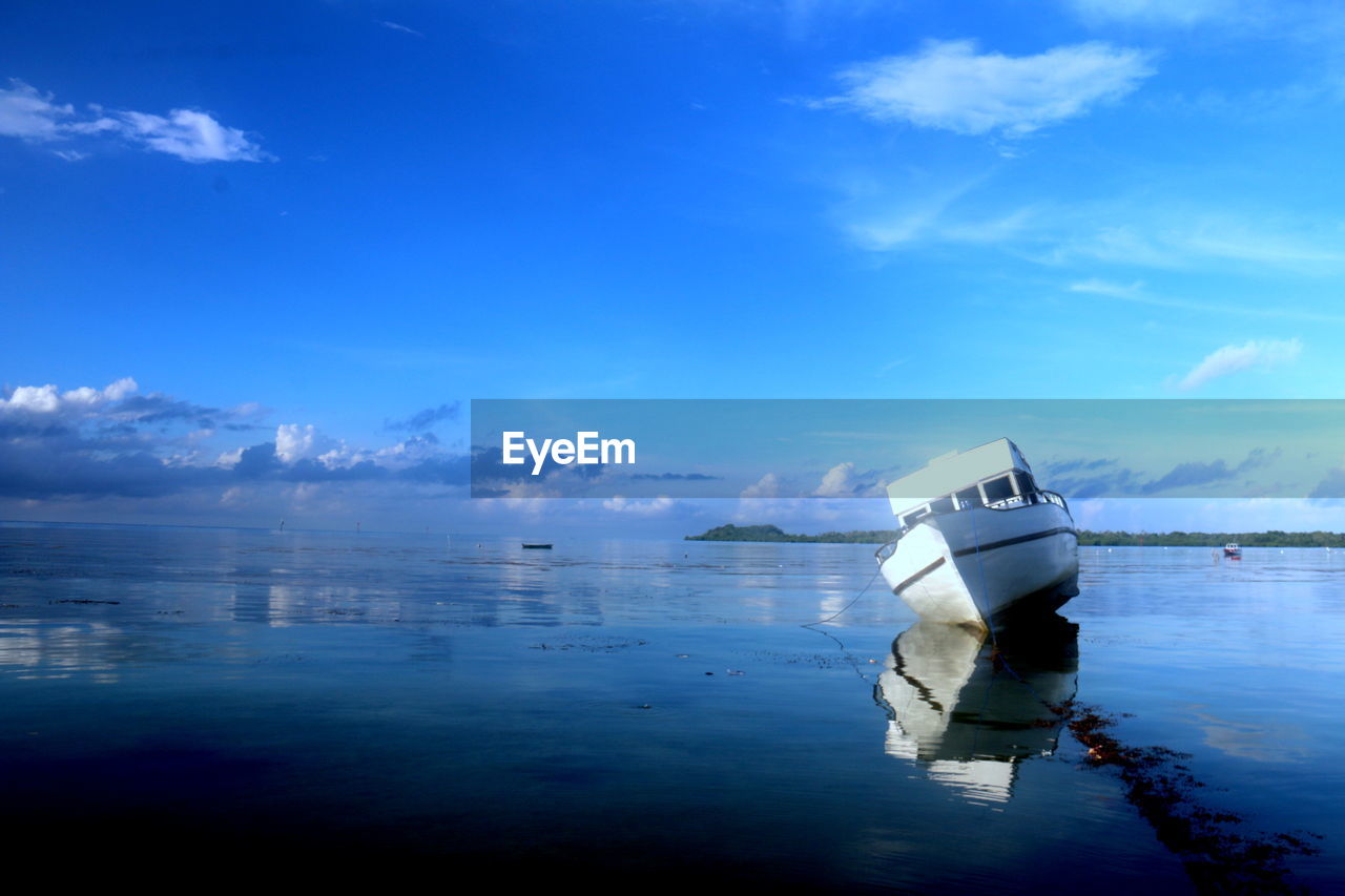 Boat in sea against sky