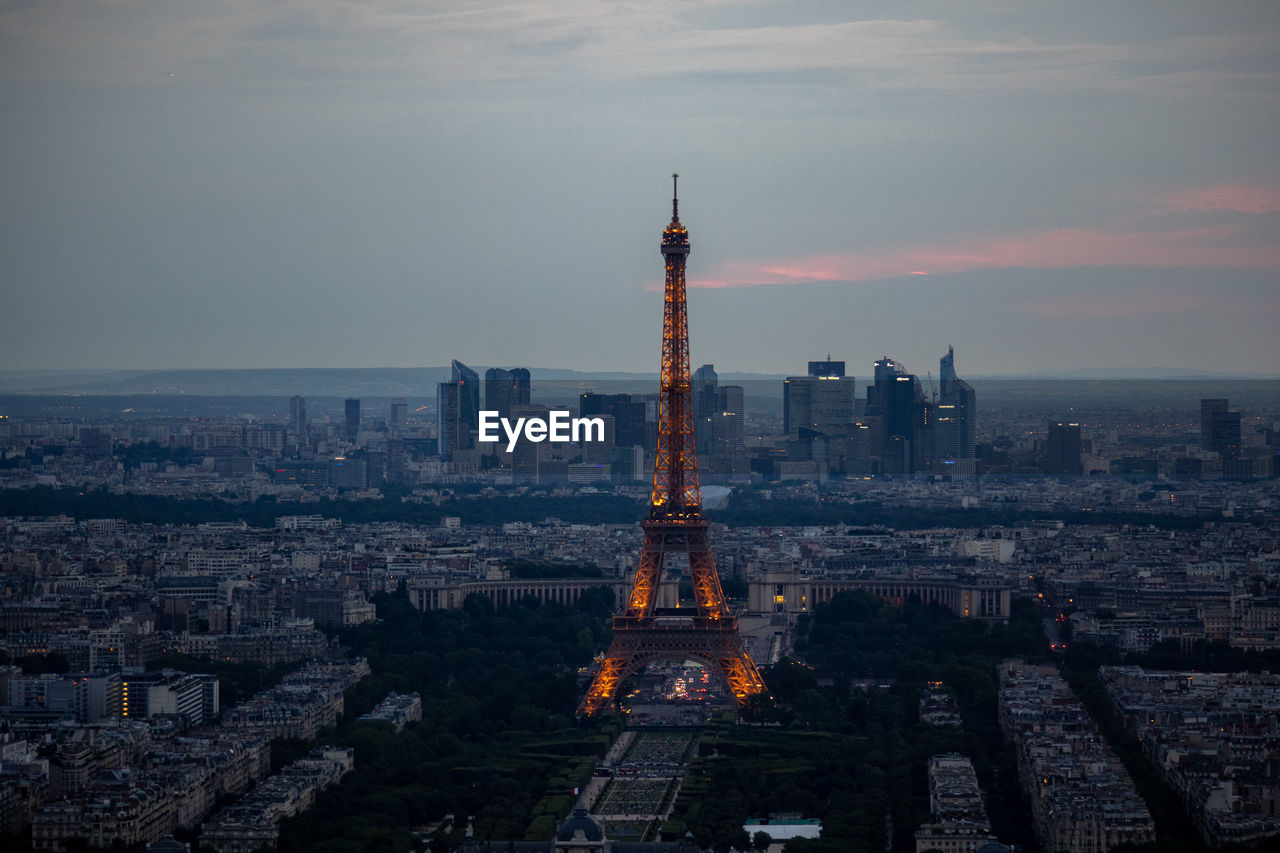 AERIAL VIEW OF BUILDINGS AGAINST CLOUDY SKY