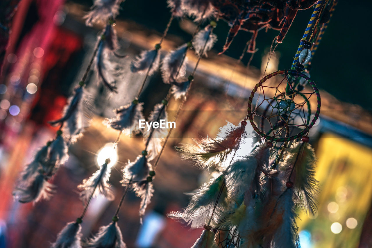 Close-up of dreamcatcher hanging at home