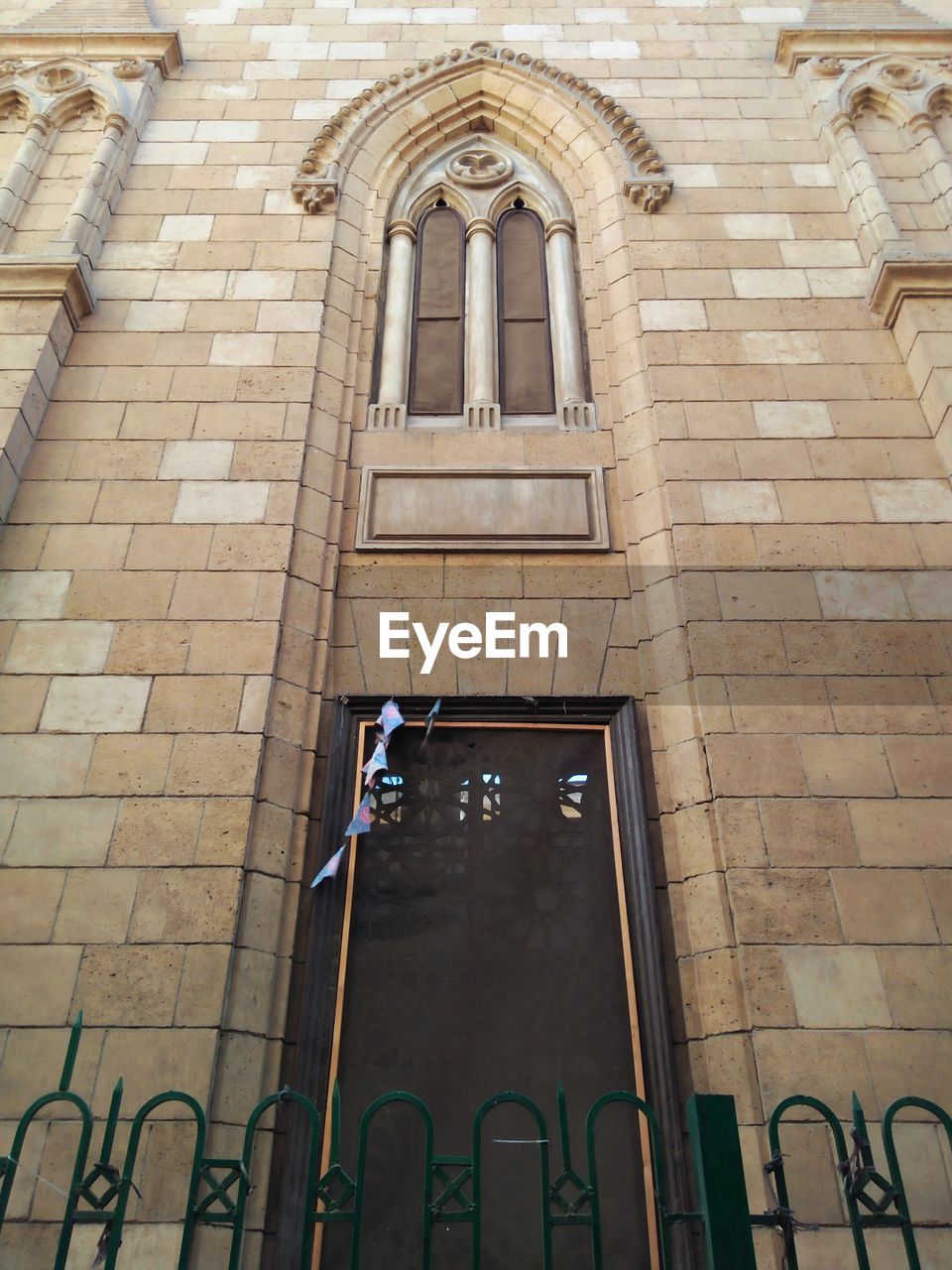 LOW ANGLE VIEW OF A WINDOW OF A BUILDING