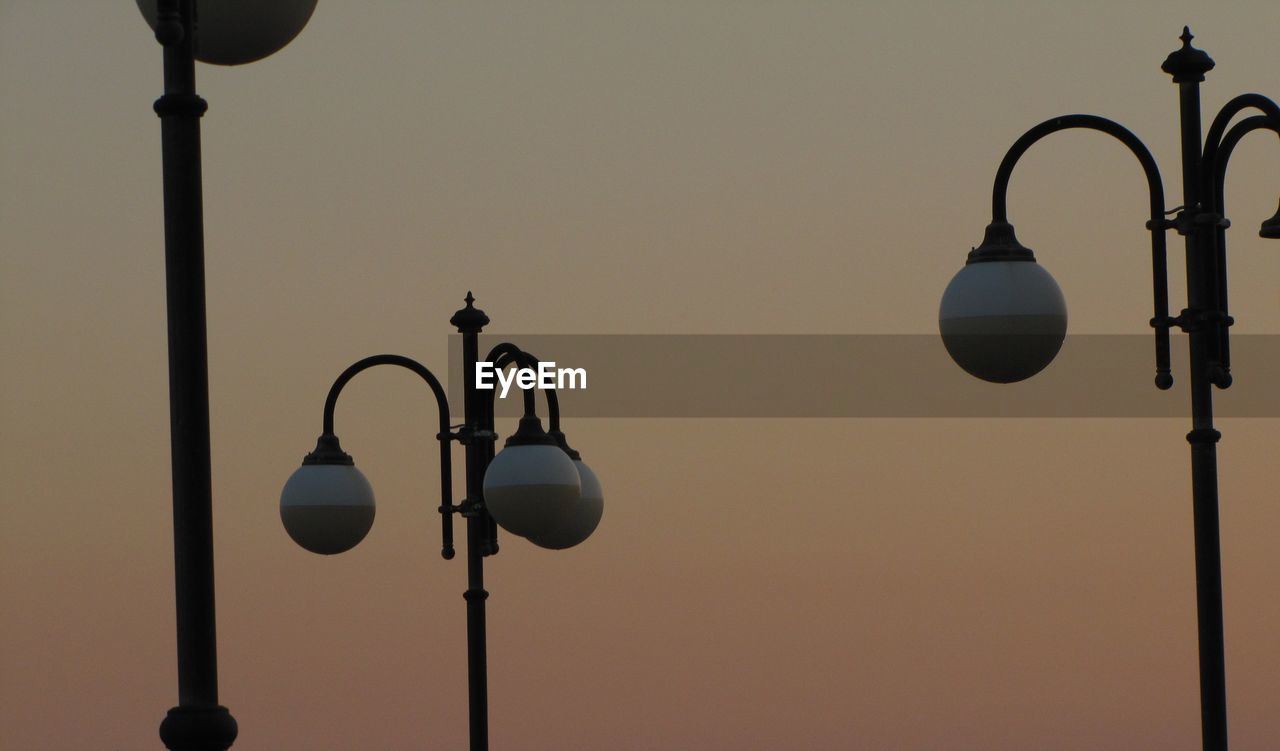 Low angle view of street light against clear sky