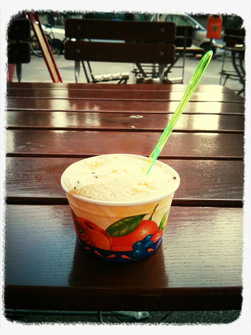 Cup of ice cream on table