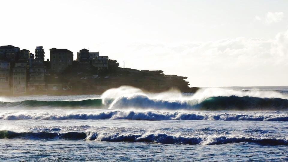 WAVES SPLASHING ON ROCKS