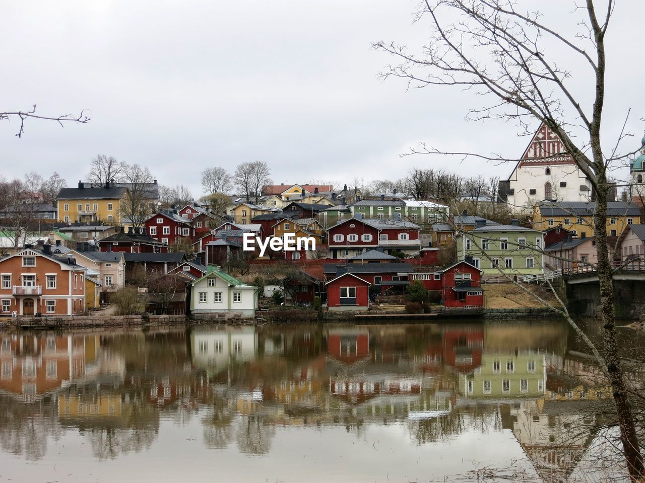 TOWN BY LAKE AGAINST SKY