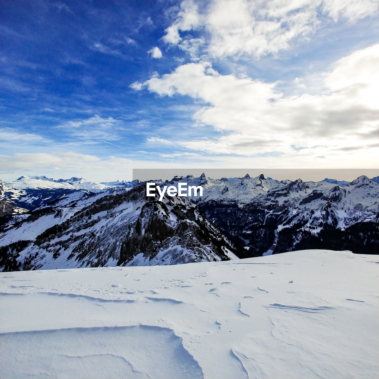 Scenic view of snowcapped mountains against sky