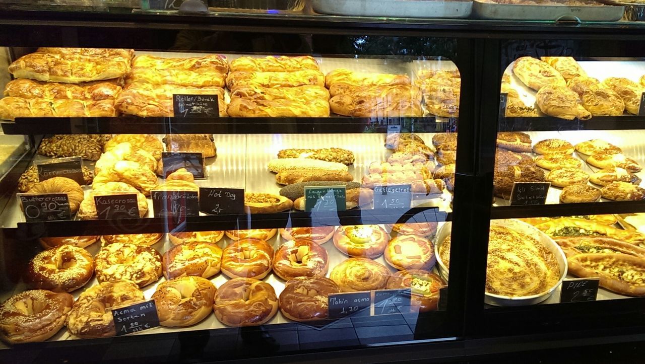 High angle view of baked pastry items in bakery