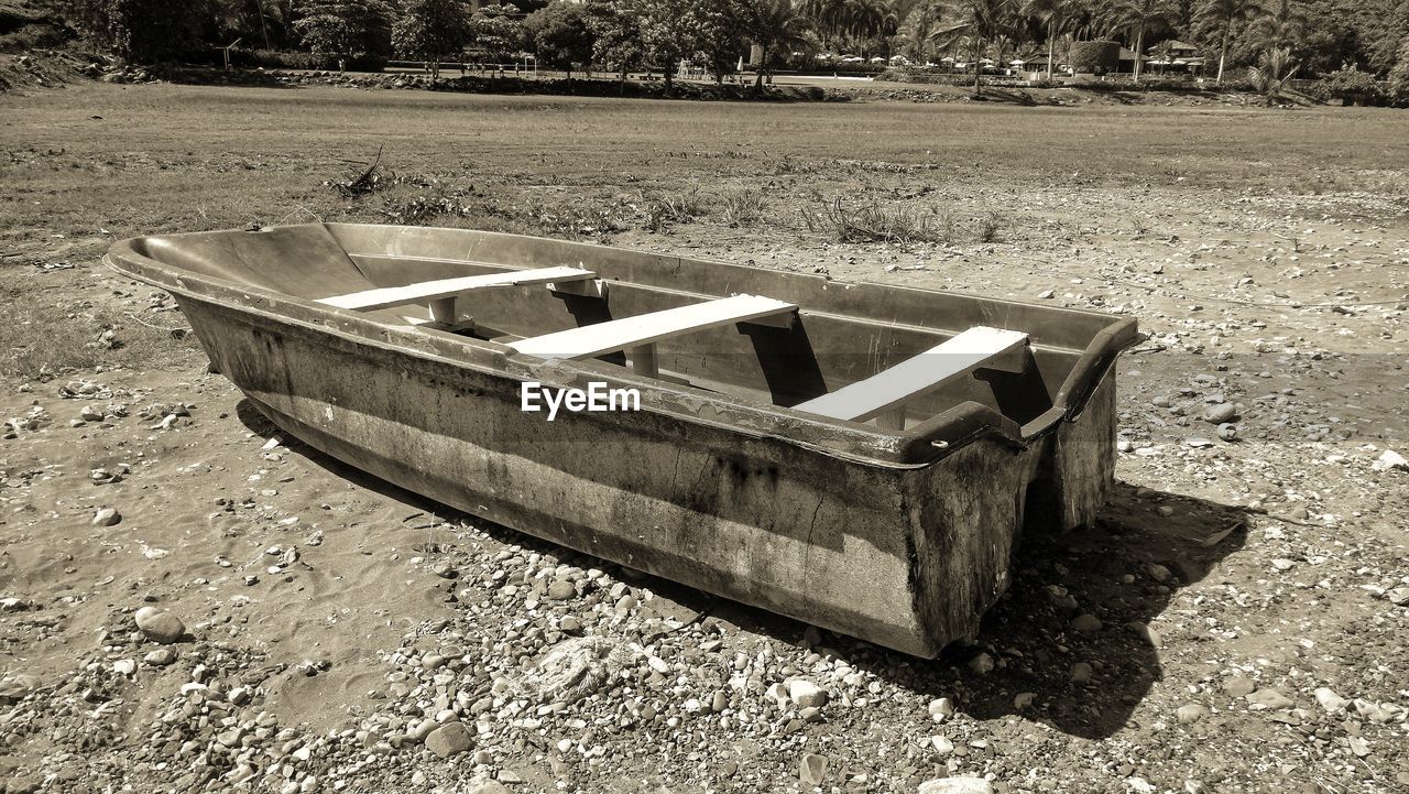 HIGH ANGLE VIEW OF ABANDONED BOAT AT PARK