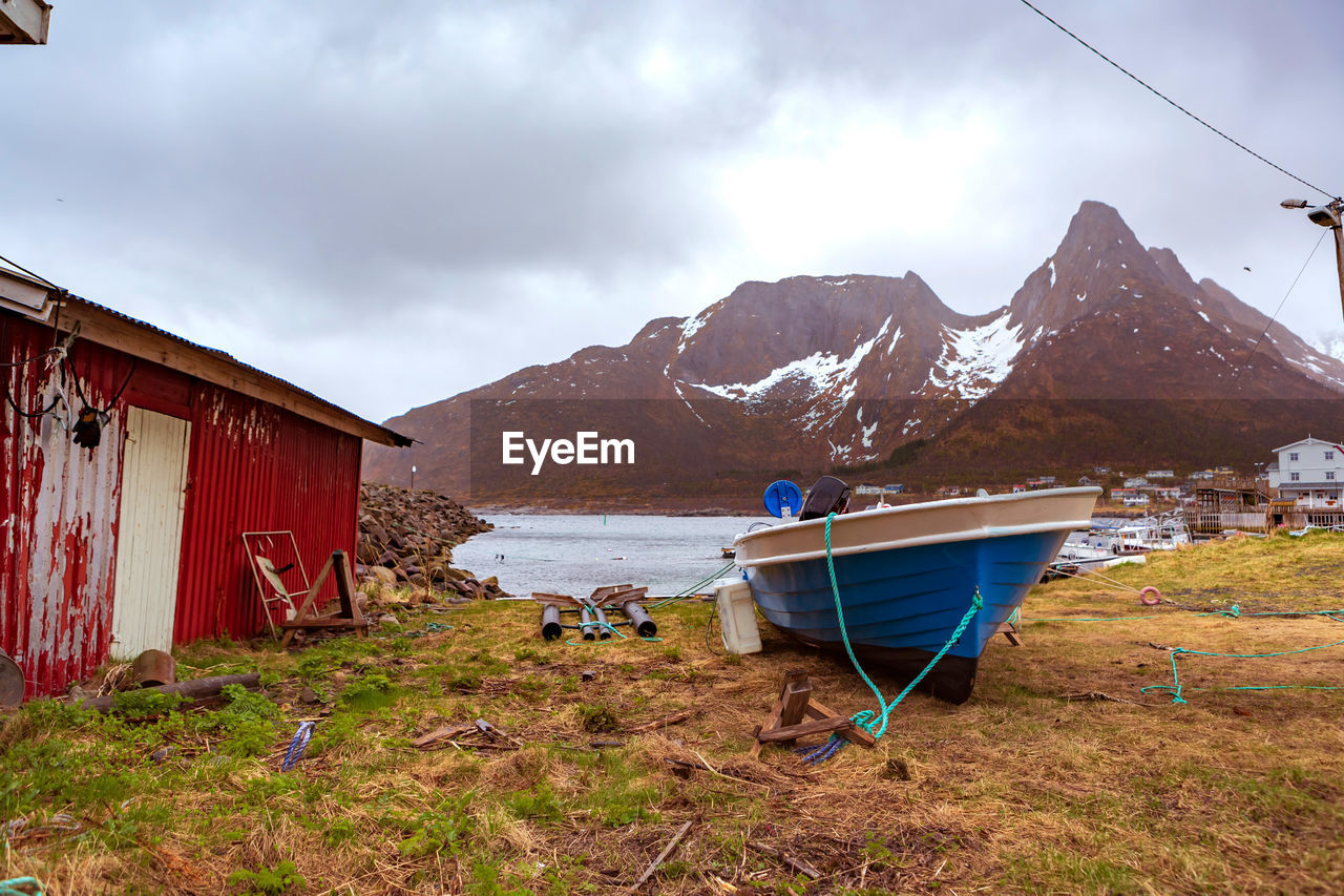 scenic view of mountains against cloudy sky