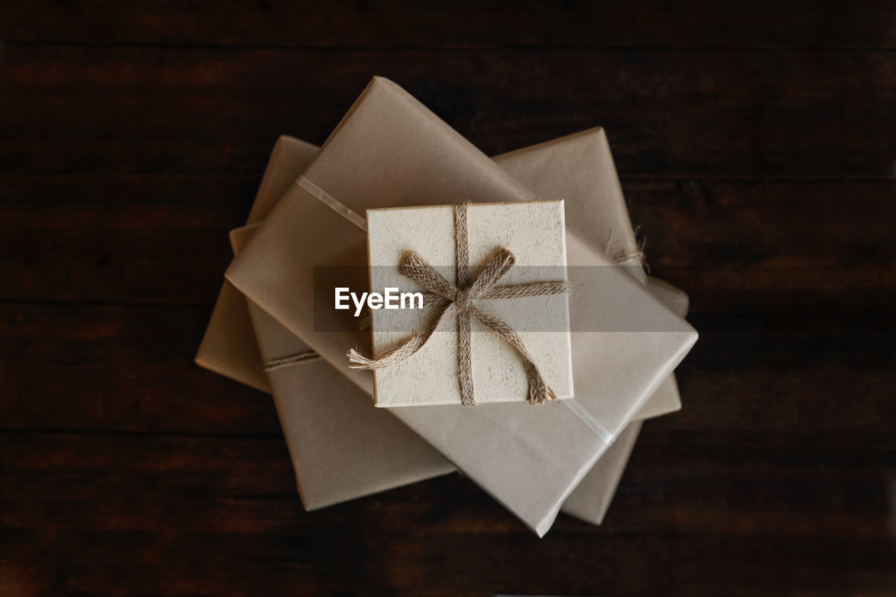 Top view stack of many xmas gift boxes wrapped in recycled kraft paper. eco-friendly, sustainable, 