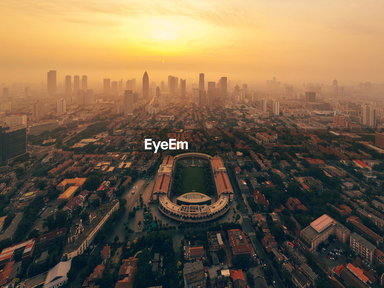 High angle view of city buildings during sunset