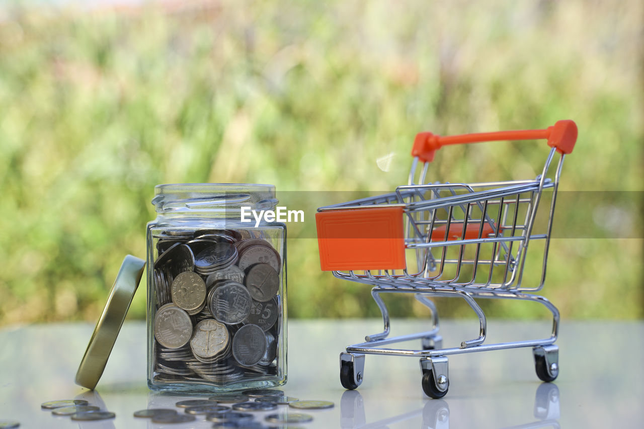 CLOSE-UP OF COIN ON TABLE