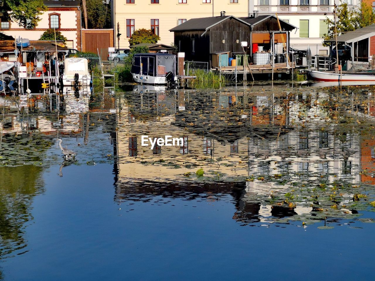 REFLECTION OF BUILDINGS ON LAKE