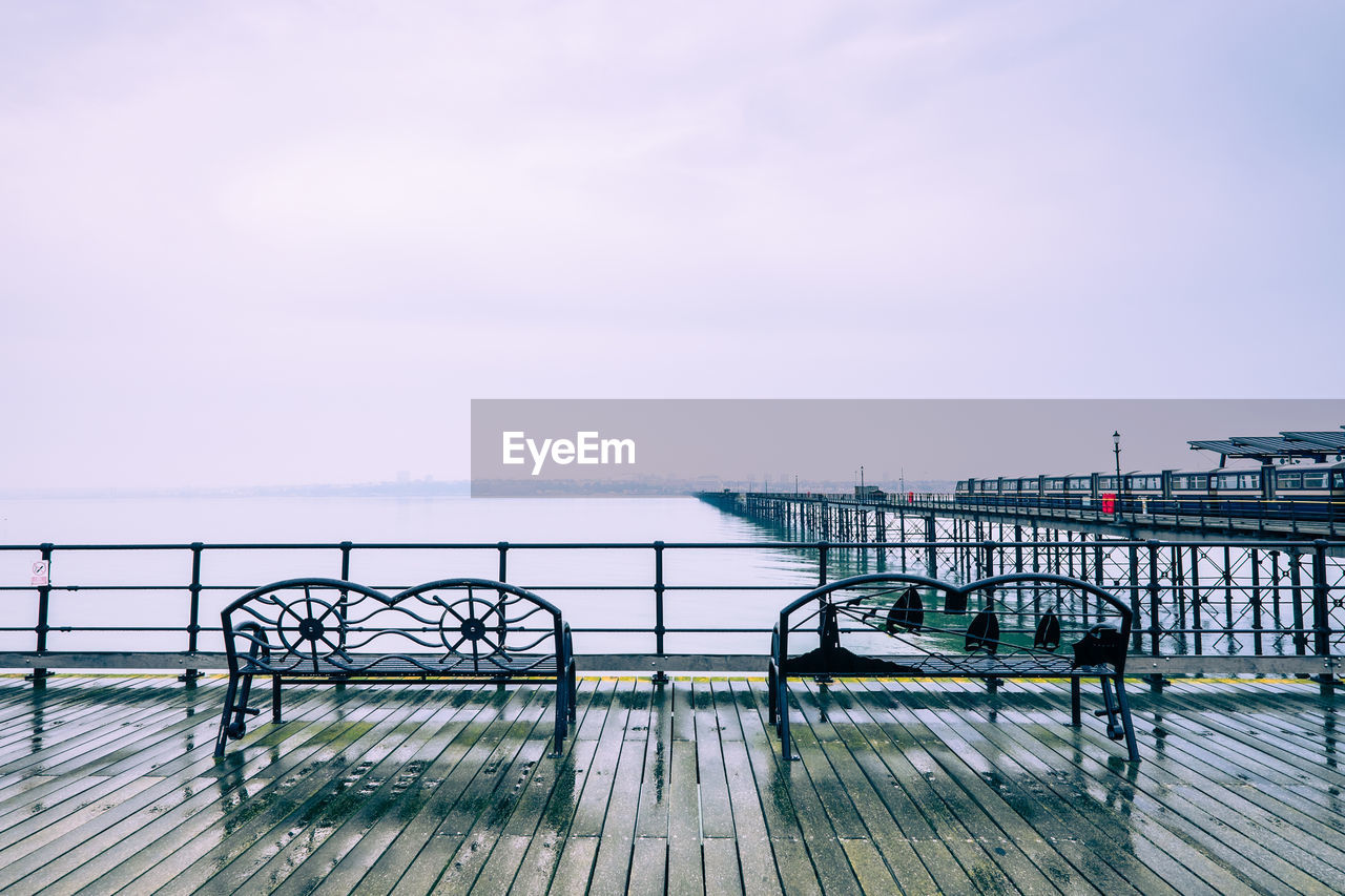 Pier over sea against sky