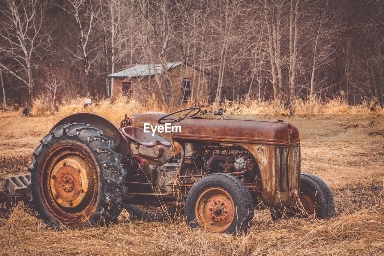 Abandoned tractor on field