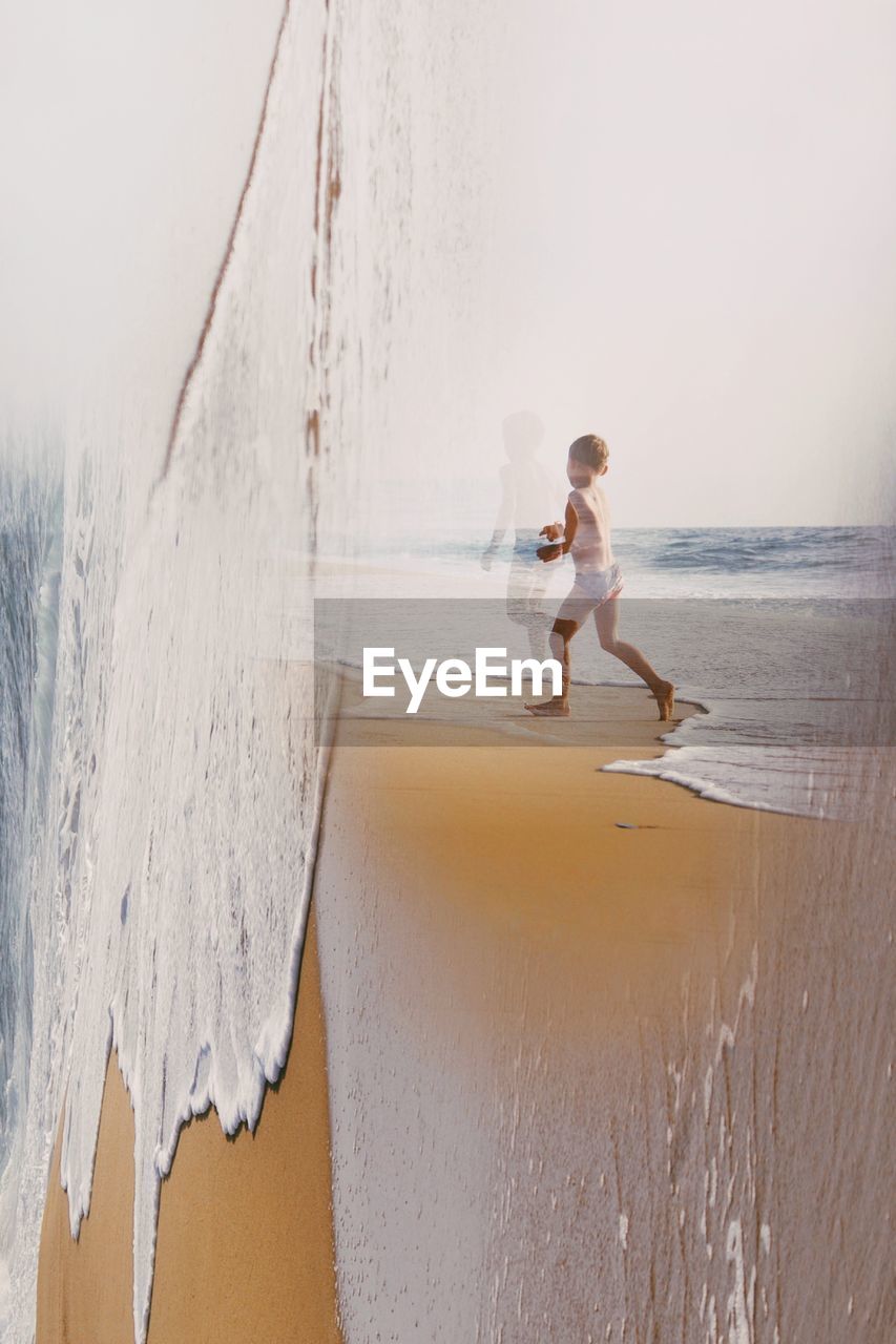 FULL LENGTH SIDE VIEW OF WOMAN ON BEACH