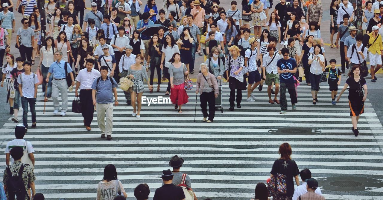 High angle view of people on zebra crossing in city