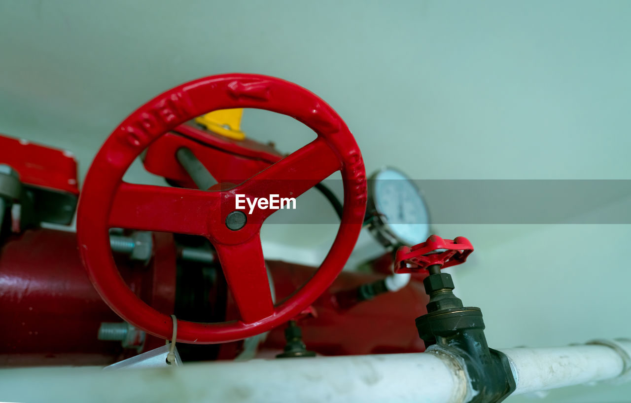 Red hand wheel of main supply water piping in the fire extinguishing system and white water supply