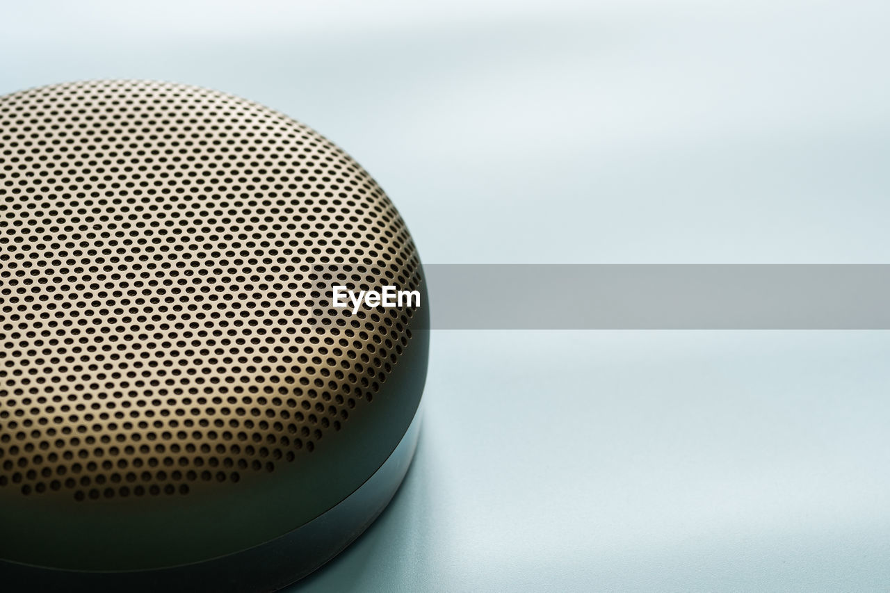 Close-up of bluetooth speaker against white background