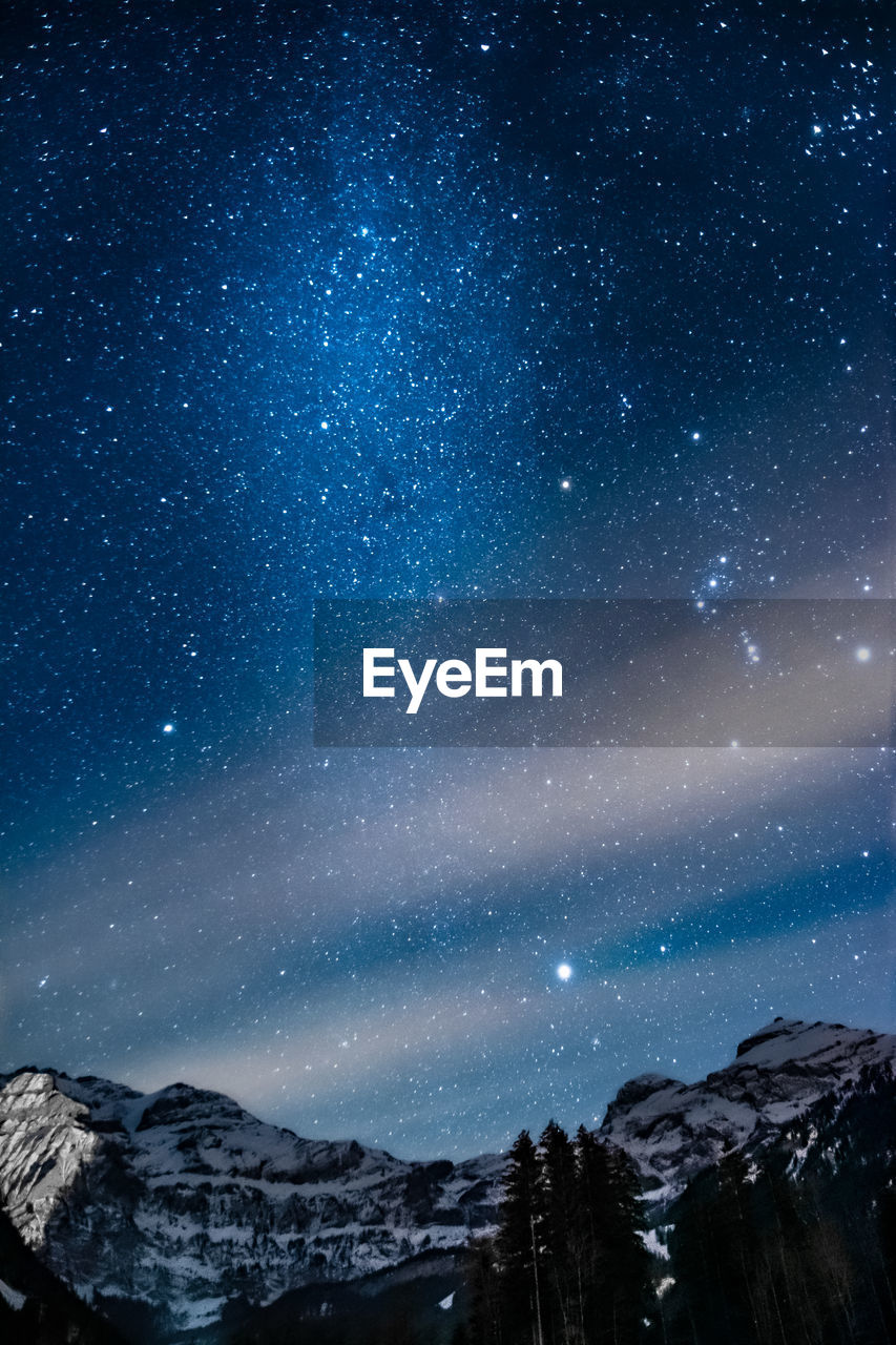 scenic view of mountain against sky at night