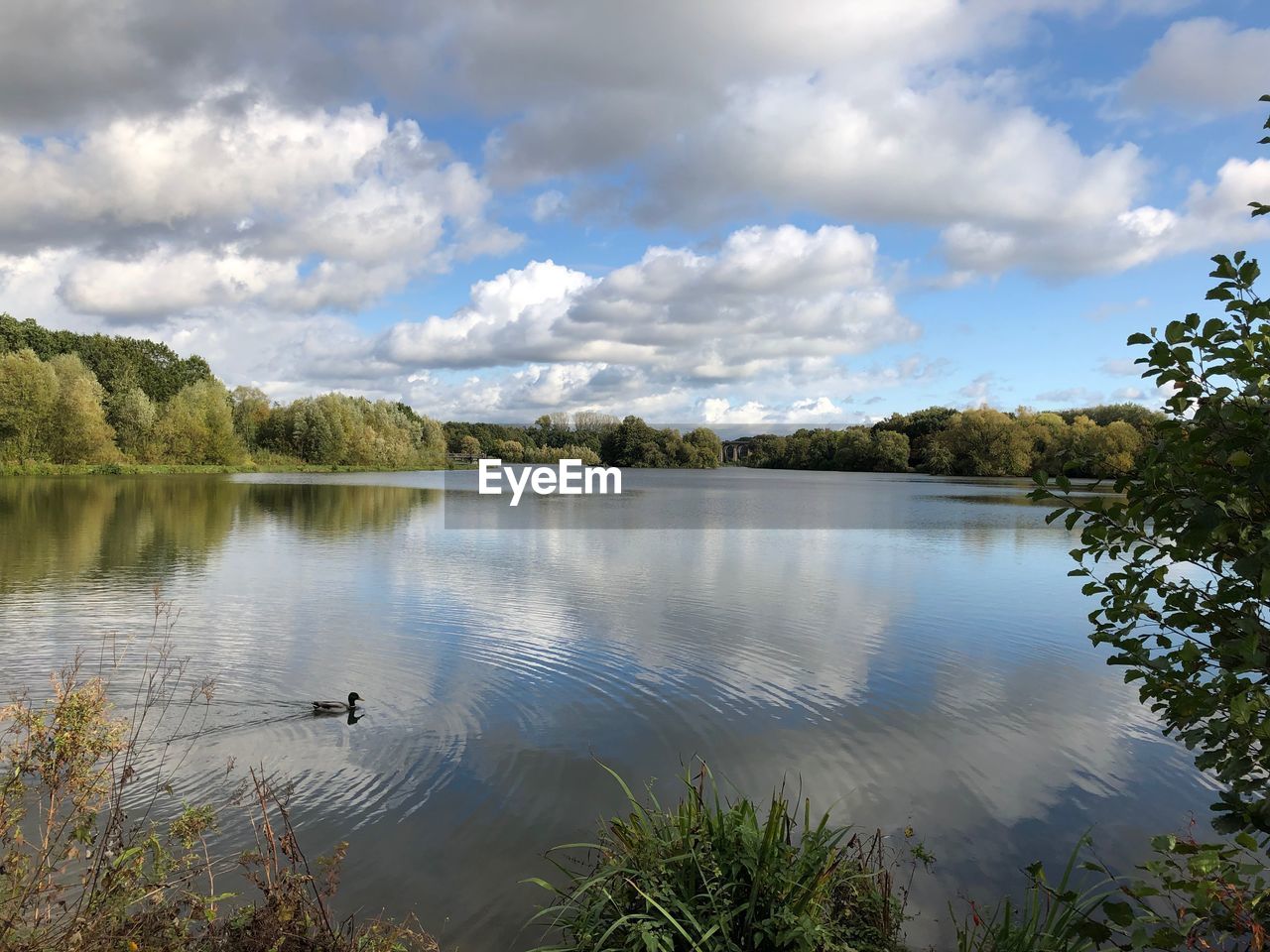 View of lake against cloudy sky