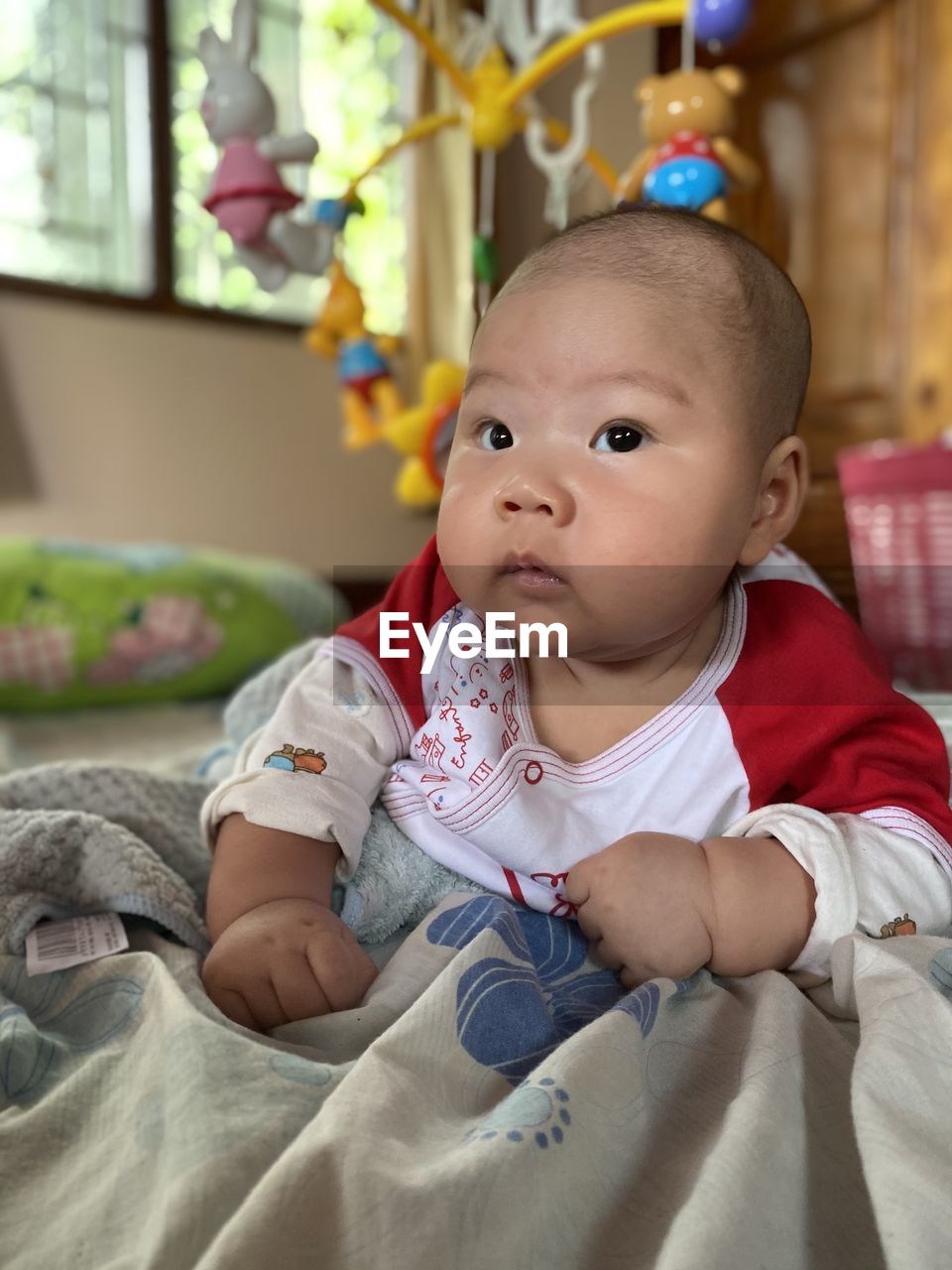 PORTRAIT OF CUTE BABY BOY AT HOME