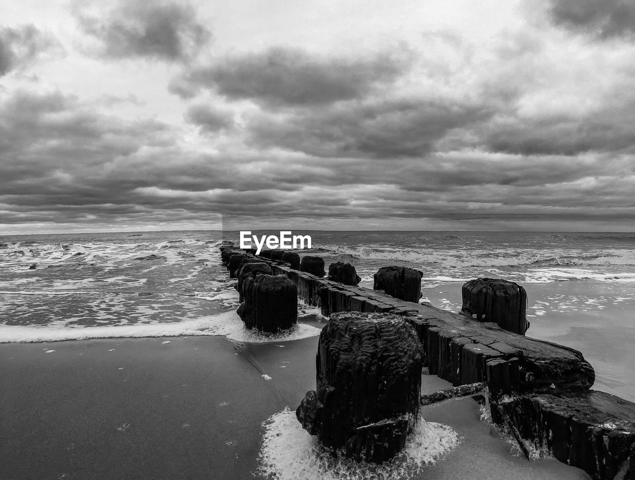 Scenic view of sea against cloudy sky