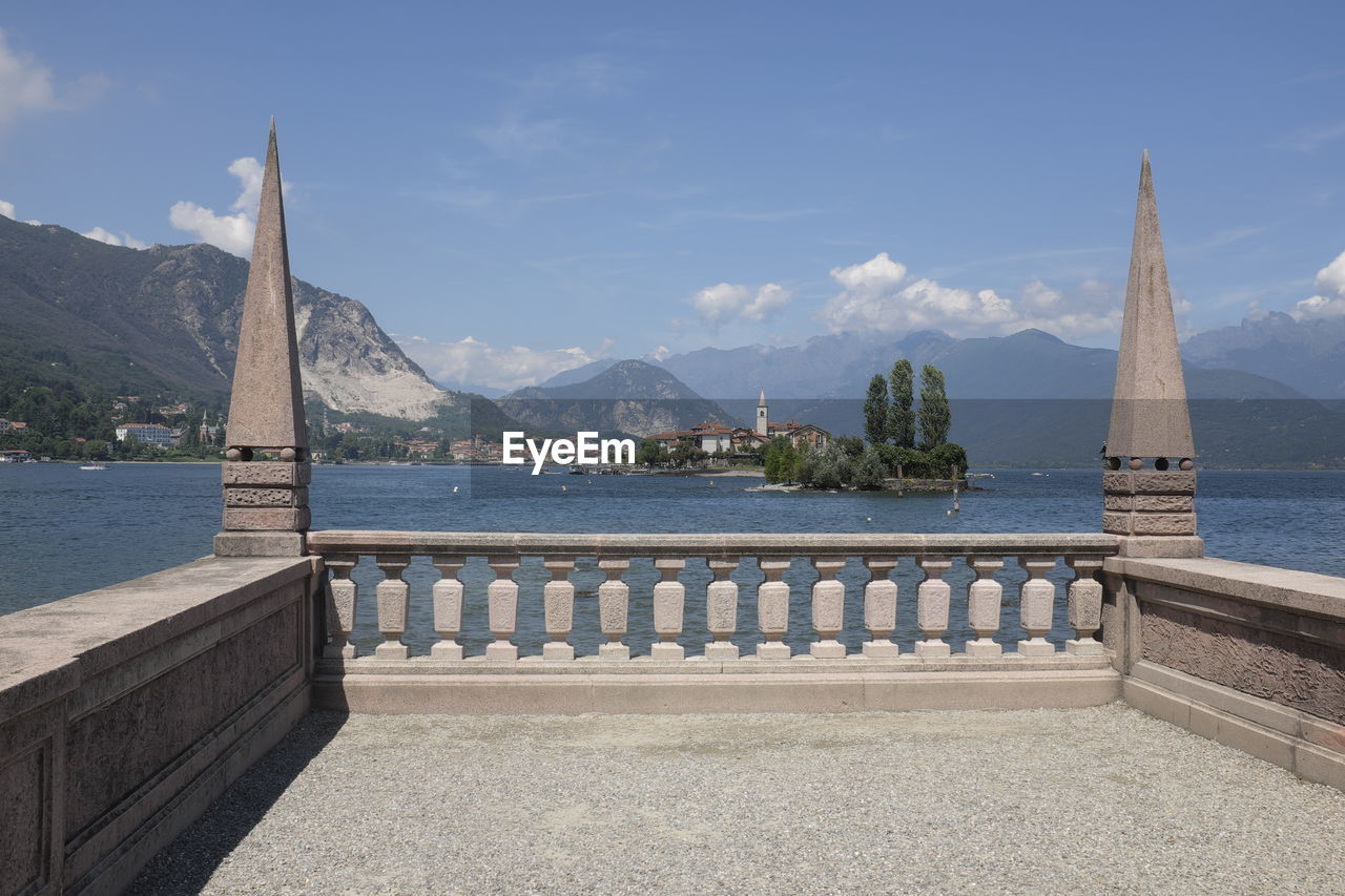 VIEW OF BAY AGAINST MOUNTAIN RANGE