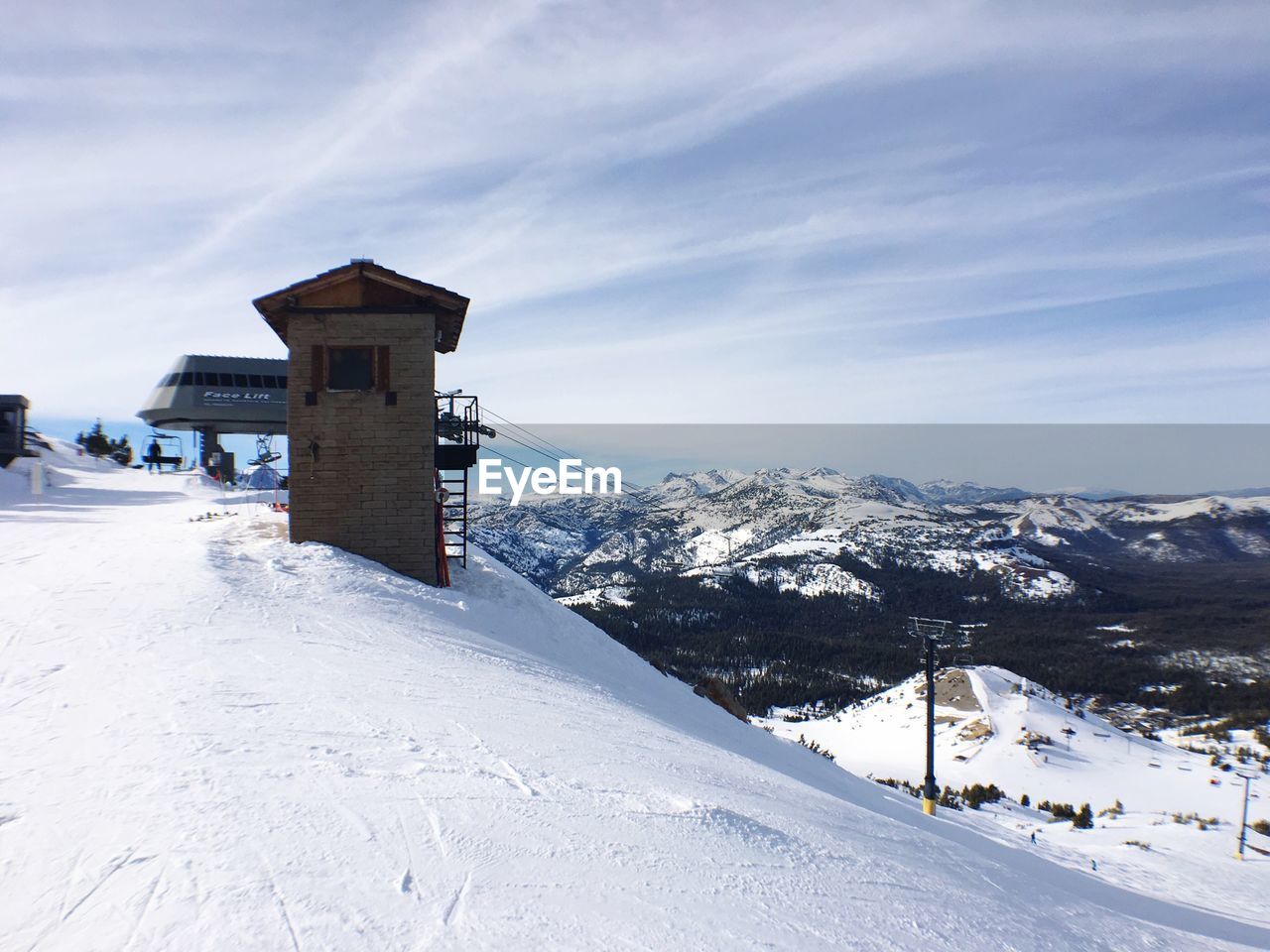 Overhead cable car station against sky during winter